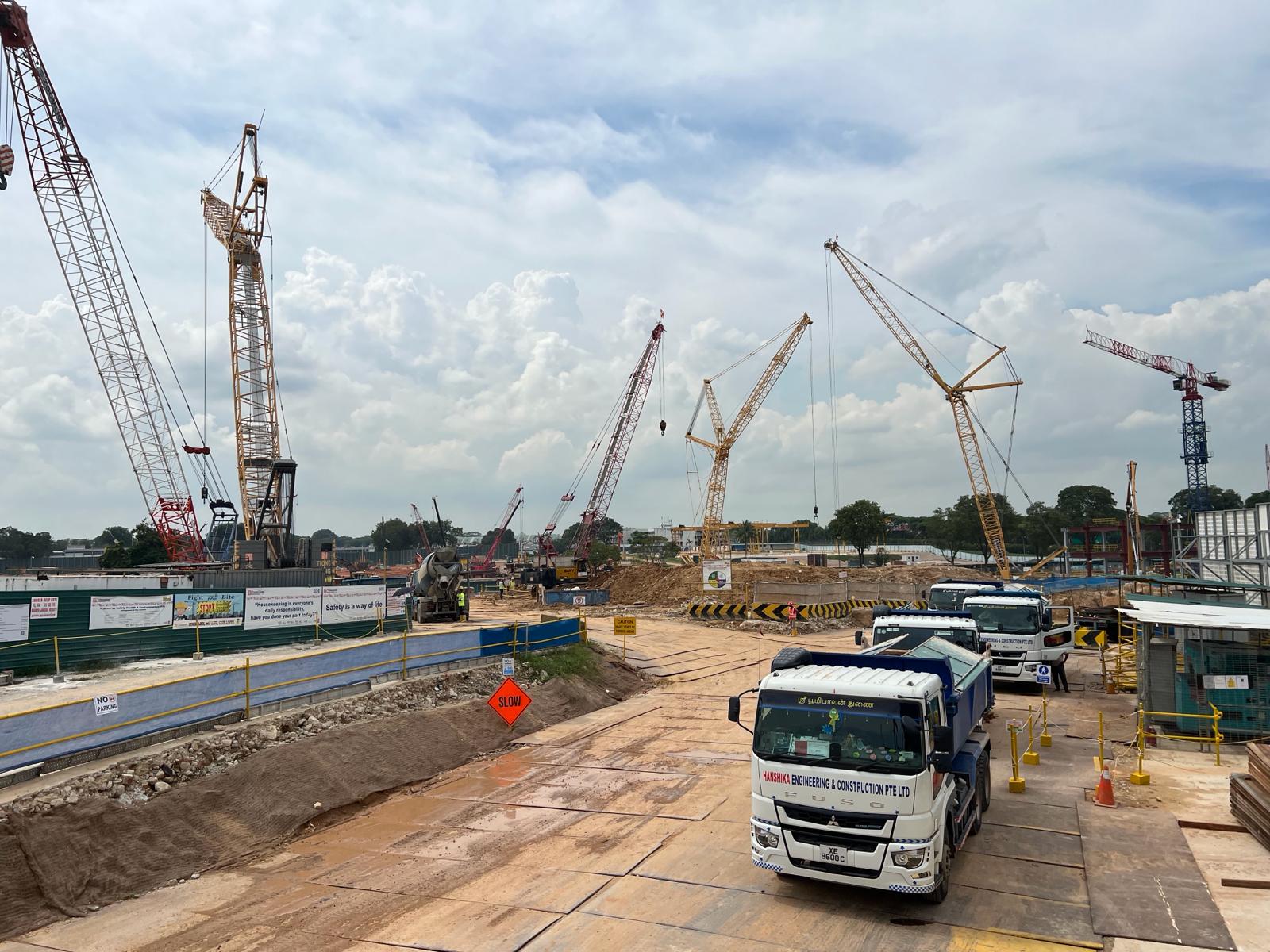 Active construction site with multiple cranes